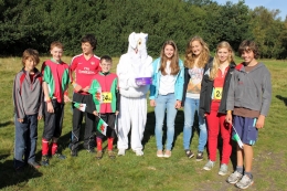 The Peter Palmer relay team posing with rabbit, 